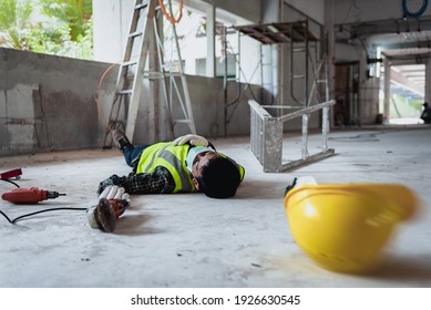 Work Accidents Of Worker In The Workplace At Construction Site Area, Builder Accident Falls Ladder On Floor And Unconscious, Electric Suction, Unsafe Concept. Add Zoom Filter Effect For Feelings.