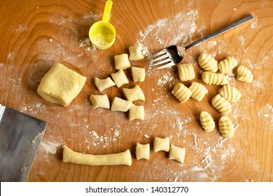 Work Board For Making Gnocchi, Or Potato Pasta, With Fork, Bench Scraper, Dough And Flour