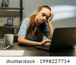 Work burnout. Unhealthy workload. Freelancer tiring lifestyle. Exhaused employee sleeping on desk in front of laptop in dark office workspace