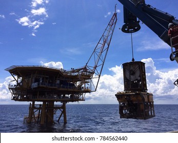 Work Class ROV Being Deployed With Wellhead Platform Background