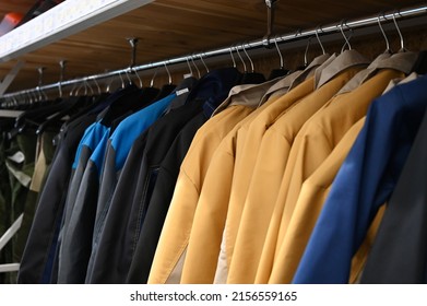 Work Clothes On Hangers In The Store. Jackets Workwear For Builders And Industry