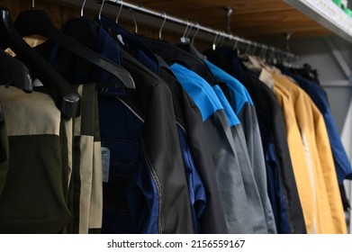 Work Clothes On Hangers In The Store. Jackets Workwear For Builders And Industry