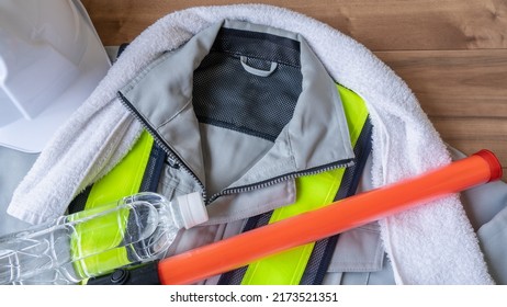 Work Clothes And Water.Workers To Prevent Heat Stroke.Red Stick And Security Guard Uniform.