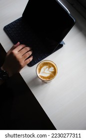 Work in Coffeeshop with a Hot Caffelatte