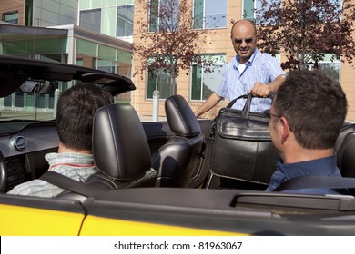 Work Colleagues Car Pooling From The Office