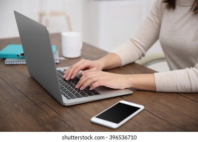 Work concept. Woman using laptop - Shutterstock ID 396536710