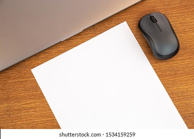 Work desk with blank empty white page, copy space. Desk top view, text space, mock up. Office desk.