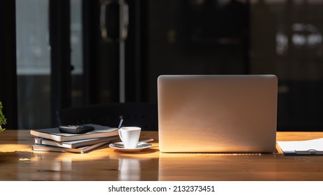 Work Desk With Laptop, Documents And Calculator On The Table And Coffee Mug.