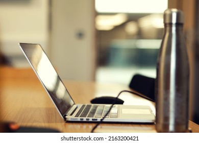 Work Desk Laptop Next To With Water Canteen Inside College Study Room