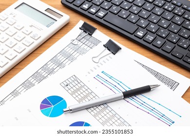 Work documents and computer on the desk.