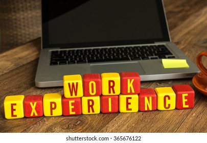 Work Experience Written On A Wooden Cube In A Office Desk