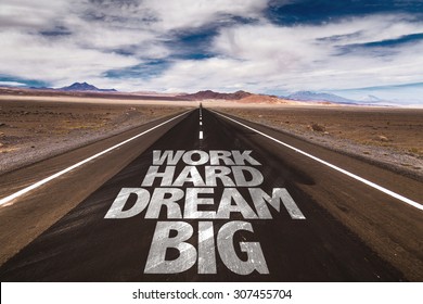 Work Hard Dream Big written on desert road - Shutterstock ID 307455704