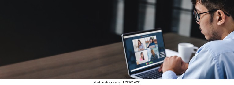 Work from home with asian businessman video conference collaboration with colleagues.live streaming meeting.banner mockup for display of content