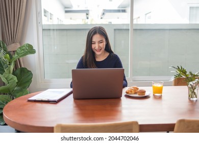 Work From Home Concept A Female Freelancer Looking Happy While Working Online In Her Own Space During Covid 19 Pandemic.