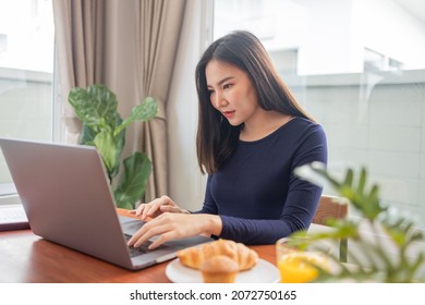 Work From Home Concept A Female Freelancer Looking Happy While Working Online In Her Own Space During Covid 19 Pandemic.