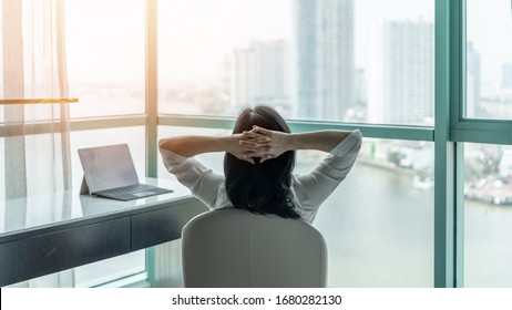 Work from home healthy lifestyle with Asian business woman life style relaxing take it easy resting in comfort hotel or living room having free time with peace of mind and self health balance