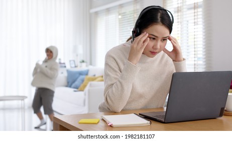 Work At Home Problem Of Asian Woman Employee Work Remotely Talk On Video Call Conference Meeting At Home Office And Kids Interruption Breakout Behind In Self Quarantine Social Distance Coronavirus.