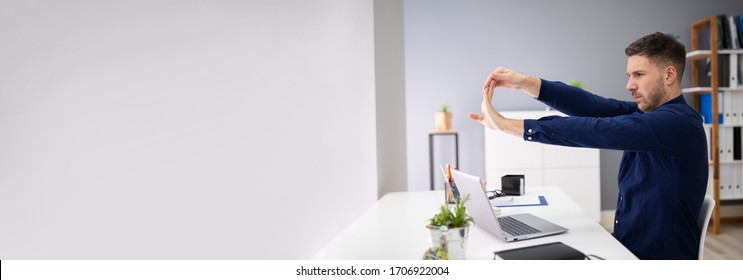 Work From Home Stretch Exercise At Computer Desk