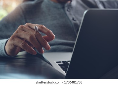 Work from home, teleworking, Online job concept. Close up, business man, freelance sitting on sofa surfing internet and relaxed working on laptop computer at home office - Shutterstock ID 1736481758