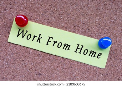 Work From Home Text On Stick Note And Pinned To A Cork Notice Board. Concept For Social Distancing And Isolation During COVID-19 Outbreak To Avoid Virus Infection.