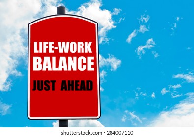 Work Life Balance Just Ahead  Motivational Quote Written On Red Road Sign Isolated Over Clear Blue Sky Background. Concept  Image With Available Copy Space