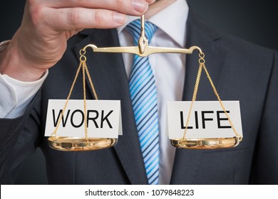 Work And Life Balance. Words Are Balanced On Scales.