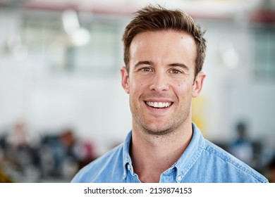 I Work For The Love Of It. Portrait Of Smiling Man In A Casual Work Environment.