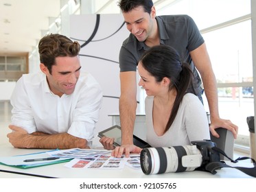 Work meeting in photo agency - Powered by Shutterstock