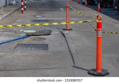  Work  Moves The Cover To Check The Sewer Line For Clogs.