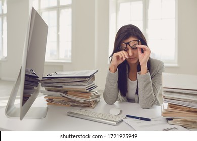 A lot of work in the office. Tired busy businesswoman is working with computer. - Shutterstock ID 1721925949