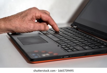 Work on the computer. Hand typing on laptop keyboard.