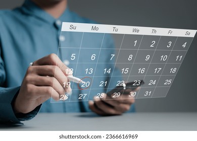 Work organization concept. Businessman checking agenda planner on digital calendar, schedule, plan, event. Highlight appointment reminders and meeting agenda on the calendar. - Powered by Shutterstock