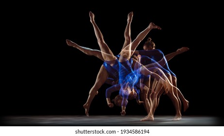Work out. Young flexible girl on black studio background in strobe, neon light. Fit female model practicing artistic gymnastics. Exercises for flexibility, balance. Grace in motion, sport, action.
