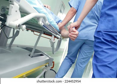 Work With The Patient In A Hospital Corridor 