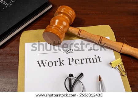 Work Permit Document on Desk Beside Gavel – Immigration Law Theme

