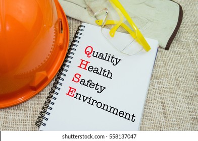 Work Place Safety And Health At Workplace Concept With QHSE Wording On Notebook