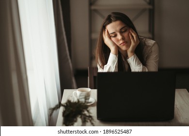 Work Problem. Routine. Lack Of Sleep. Overworking. Fatigue. Project Failure. Boring Virtual Meeting. Sad Tired Sleepy Woman Sitting At The Table In Her Home Office