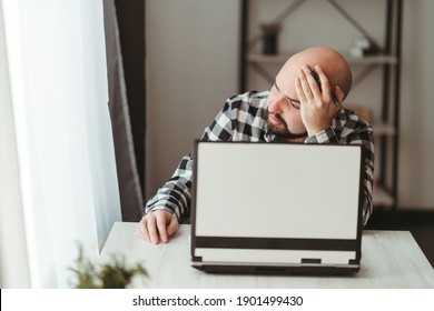 Work Problem. Routine. Lack Of Sleep. Overworking. Fatigue. Project Failure. Boring Virtual Meeting. Sad Tired Sleepy Man Sitting At The Table In His Home Office