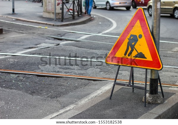 work in progress sign near tram rails in Milan,\
Lombardy, Italy