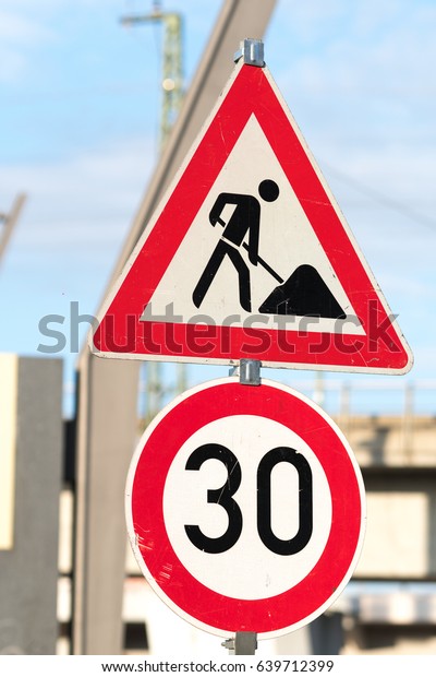 Work in progress\
and speed limit signposts