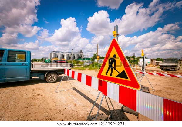 Work in progress, triangle sign with\
boundary, caution symbol on construction site.\
