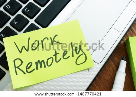 Work Remotely memo stick. Laptop for remote job.