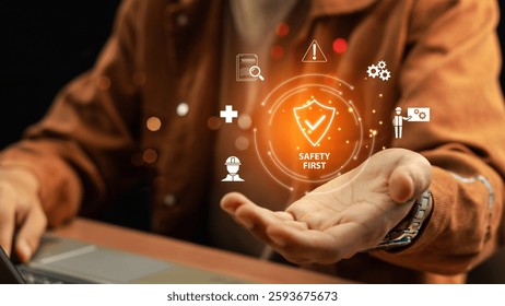 Work Safety and Compliance Concept, Safety First, Businessman touching check mark in shield icon. hard hat, checklist, workplace safety, health protocols, and regulatory compliance