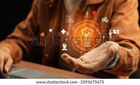 Work Safety and Compliance Concept, Safety First, Businessman touching check mark in shield icon. hard hat, checklist, workplace safety, health protocols, and regulatory compliance