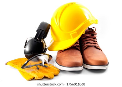 Work Safety Concept With Hard Hat, Protective Gloves, Boots, Eye Safety Glasses And Hearing Protecting Noise Canceling Earmuffs Isolated On White Background With A Clipping Path Included