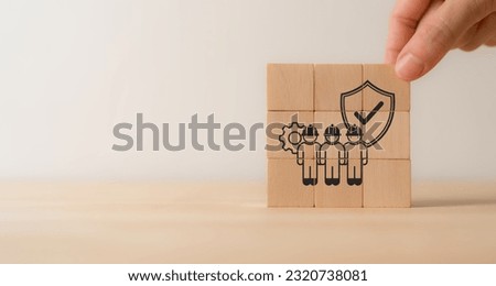 Work safety concept. Wooden cube blocks with icon of safety at workplace. Safety first, protections, health, regulations and compliance. Working standard process. Zero accidents.