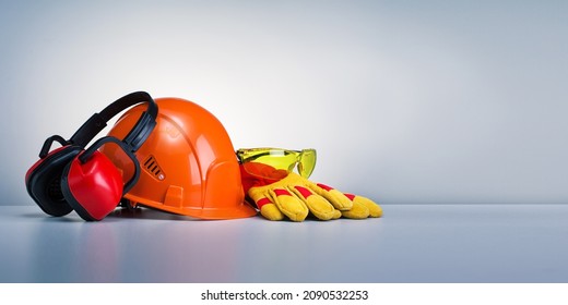 Work safety protection equipment on grey background with copy space. Horizontal banner. - Shutterstock ID 2090532253