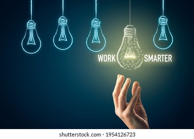 Work smarter concept with light bulb. Male hand pick light bulb (symbol of intelligence, creativity and innovation) which is lightened.