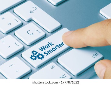 Work Smarter Written on Blue Key of Metallic Keyboard. Finger pressing key.