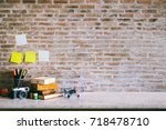 Work space Artist or designer Mock up : Desk space  or tabletop with vintage books, vintage camera and toys. desk with copy space for products display montage.